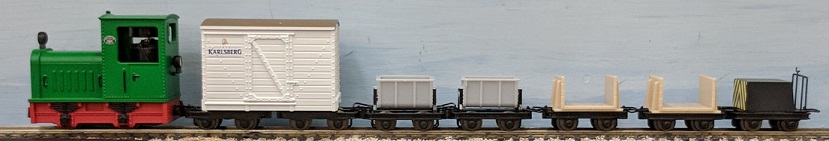 Green Gmeinder locomotive with beer car, two
cement cars, two pulpwood cars and a brake car