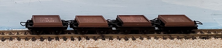4 Flat cars plastic box